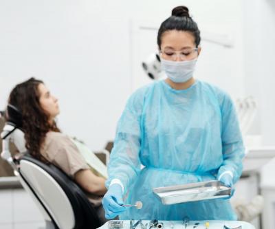 Dentist preparing patient for dental implant surgery
